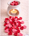 Wax melts en forma de corazón rojos y rosados con pebetero